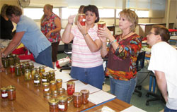 Image of EHE evaluate canned goods 6/27/07 food preservation workshop Tucumcari NM