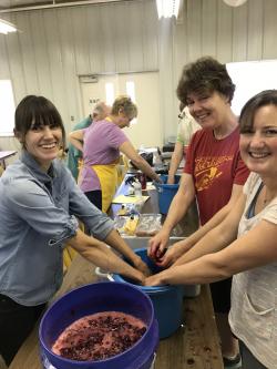 Alissa Freeman, Kelly Giese, & Miranda Kersten making cherry wine