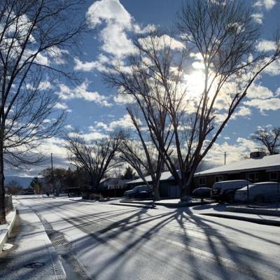 Image of a snow covered street in the neighborhood