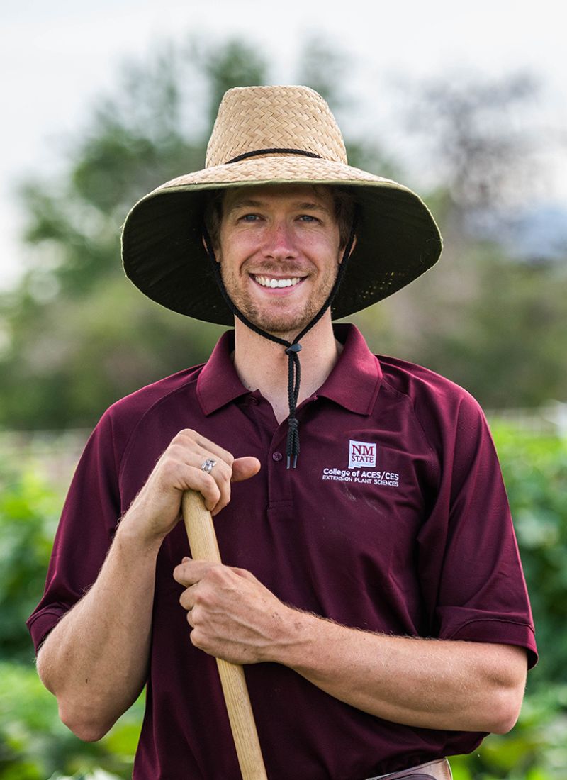 Image of student smiling in field