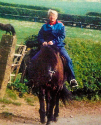 Jessie riding a horse.