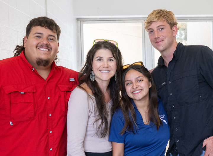 A group of ACES students smiling together on campus